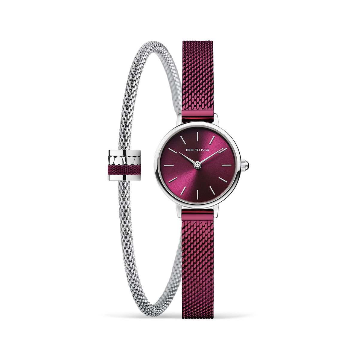 Reloj con esfera morada, correa de malla plateada y pulsera a juego.