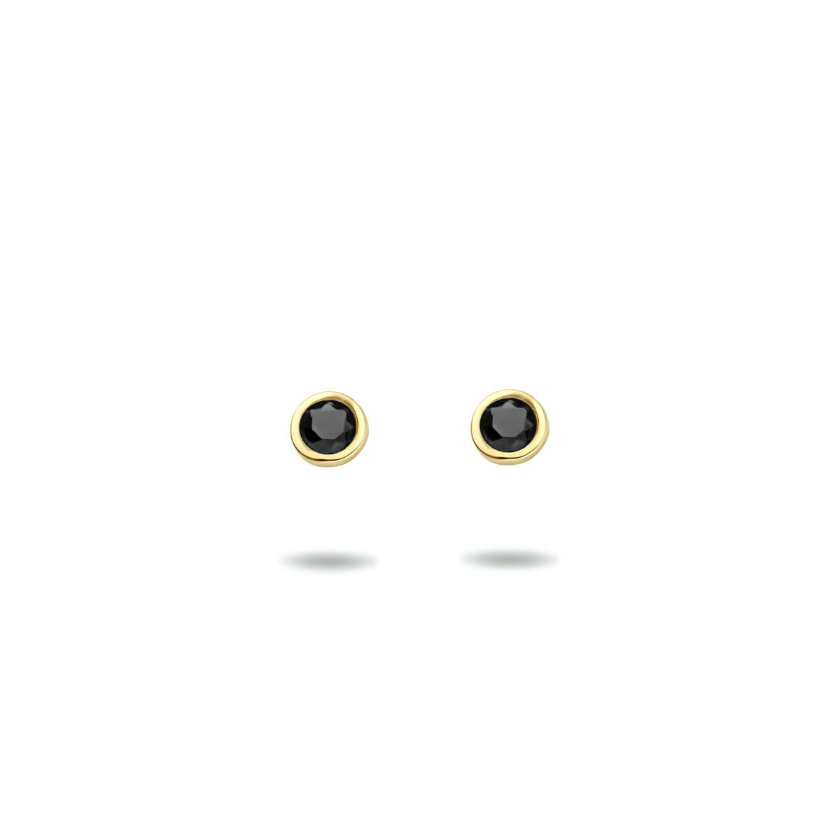Pendientes de primera puesta de zircón negro con montura de oro amarillo de 14 quilates.