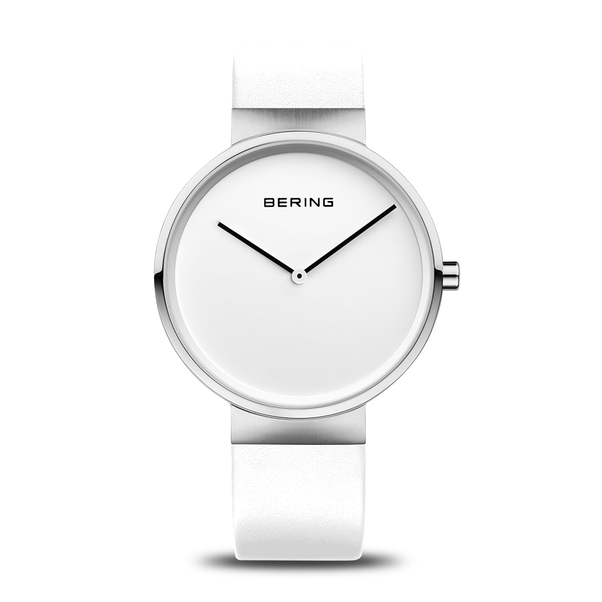 Reloj minimalista con esfera blanca y correa de silicona blanca, manecillas negras.