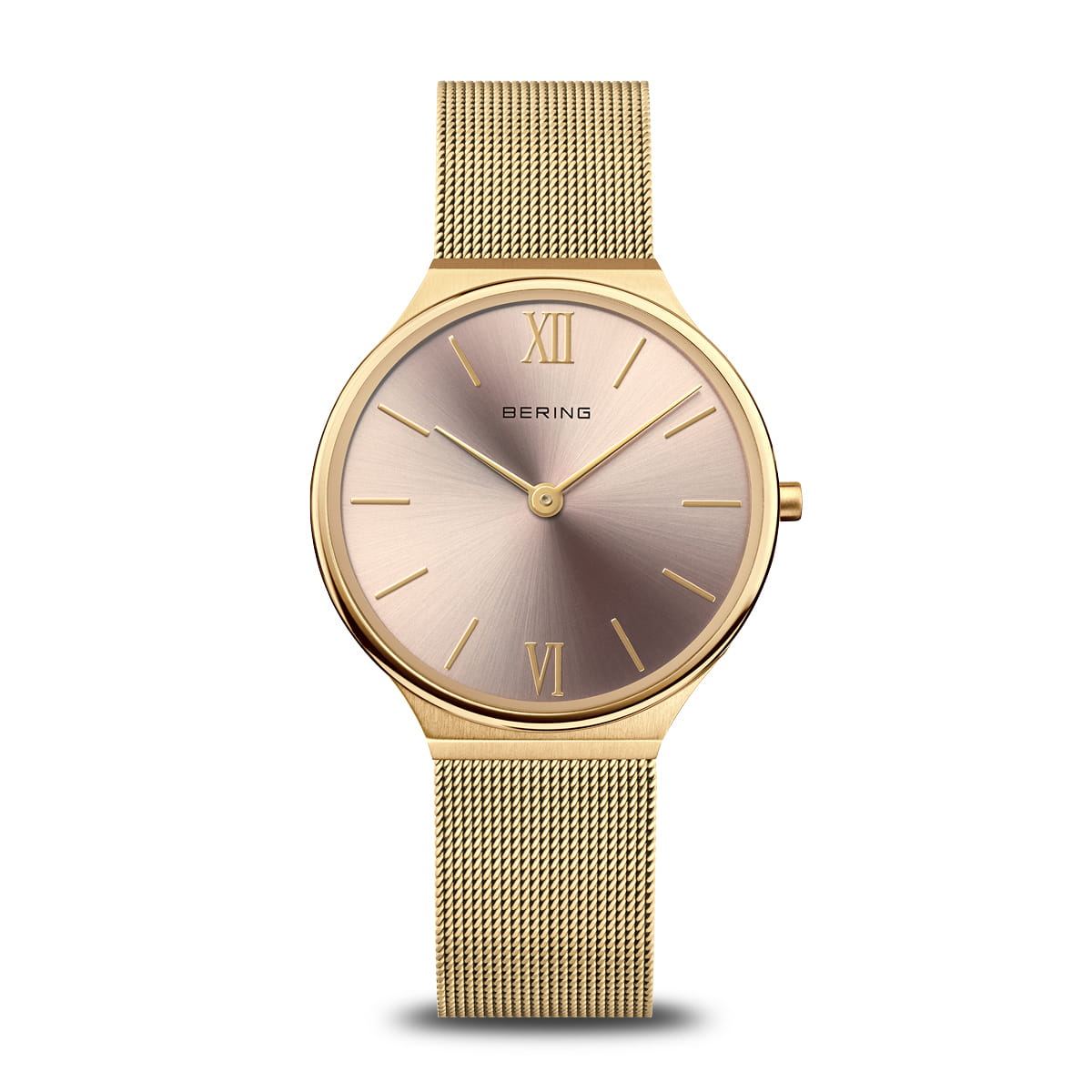 Reloj de mujer con esfera rosada y malla metálica dorada, números romanos en la esfera.