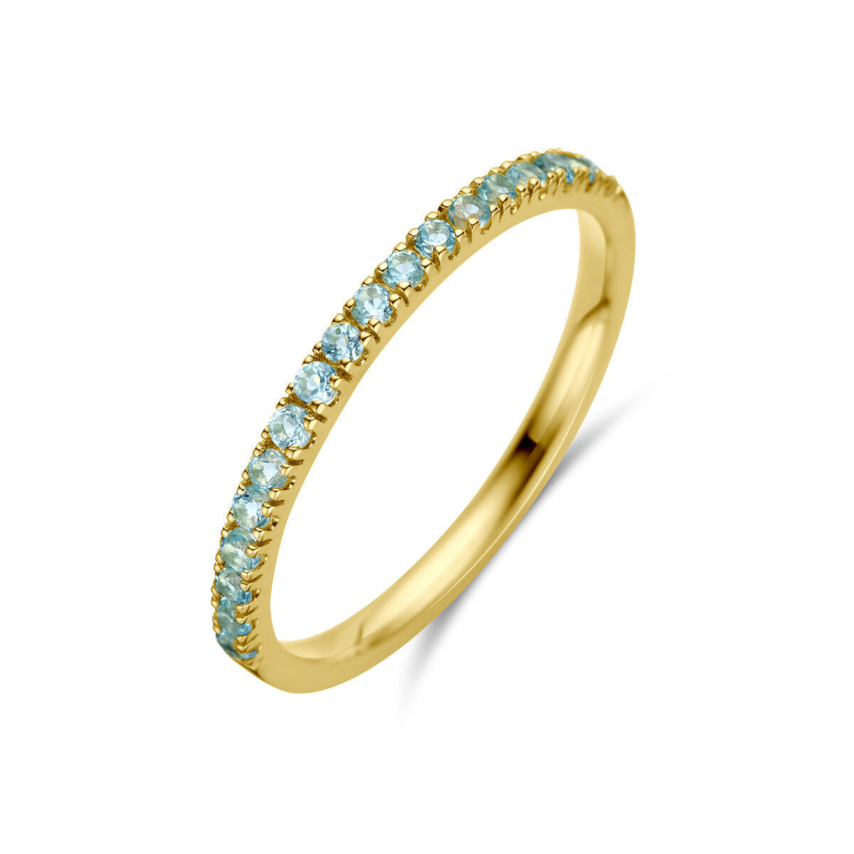Anillo de oro amarillo de 14 quilates con piedras de topacio azul de diciembre.