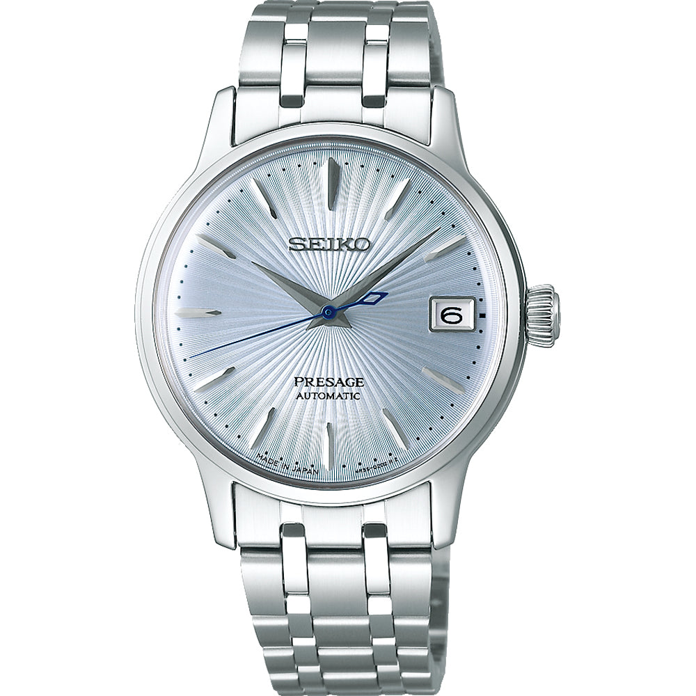 Reloj de dama Seiko Presage con esfera plateada, correa de acero inoxidable y fecha a las tres.