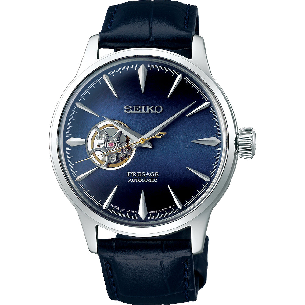 Reloj de hombre Seiko Presage con esfera azul, correa de piel negra y detalle de mecanismo visible.