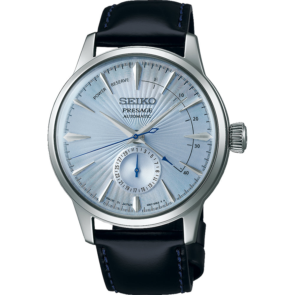 Reloj de hombre Seiko Presage con esfera plateada, caja de acero inoxidable y correa de cuero negra.