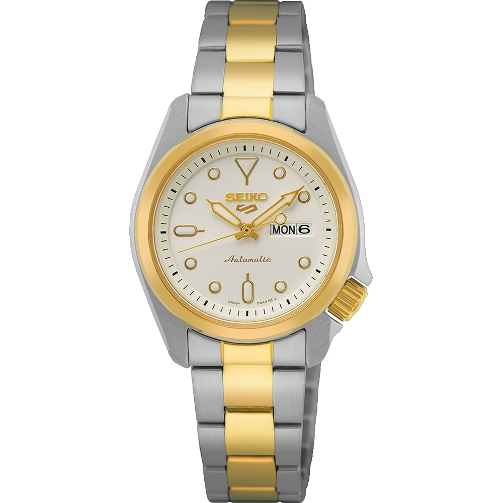 Het Seiko dameshorloge SRE004K1 van Seiko heeft een automatisch uurwerk, een ronde witte wijzerplaat met gouden markeringen en wijzers, een dag-datumaanduiding op 3 uur en een chique tweekleurige zilver-gouden band.