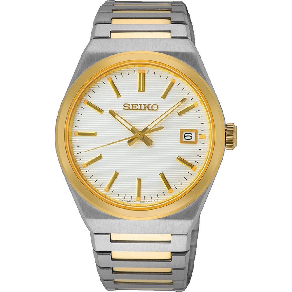 Reloj de hombre Seiko con caja plateada y detalles dorados, esfera blanca y correa de acero.