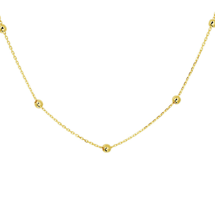 De Van der Kooij Collectie collier anker en bolletjes 1,0 mm 42-44-46 cm in 14K geelgoud heeft kleine, gelijkmatig verdeelde gouden kraaltjes op een fijne ankerschakel ketting en is afgebeeld tegen een witte achtergrond.