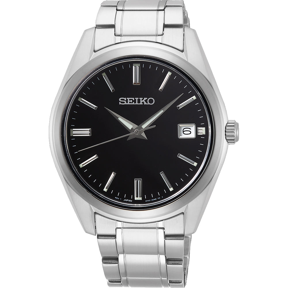 Reloj de hombre Seiko con esfera negra, caja y pulsera de acero inoxidable, y fecha en la posición de las tres.