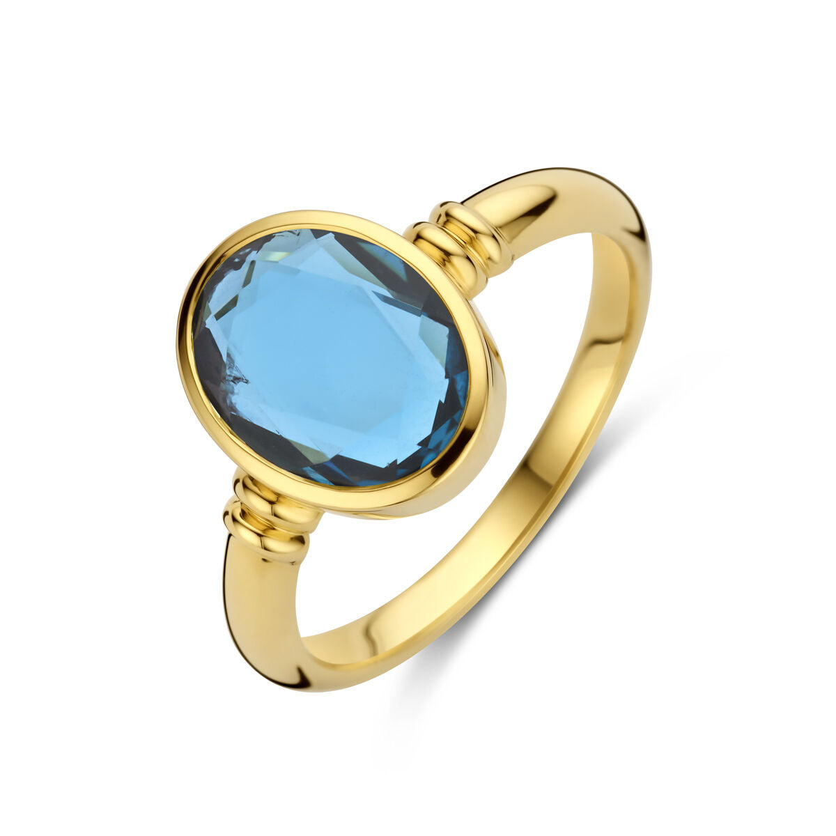 Anillo de oro amarillo de 14K con topacio azul de Londres ovalado.