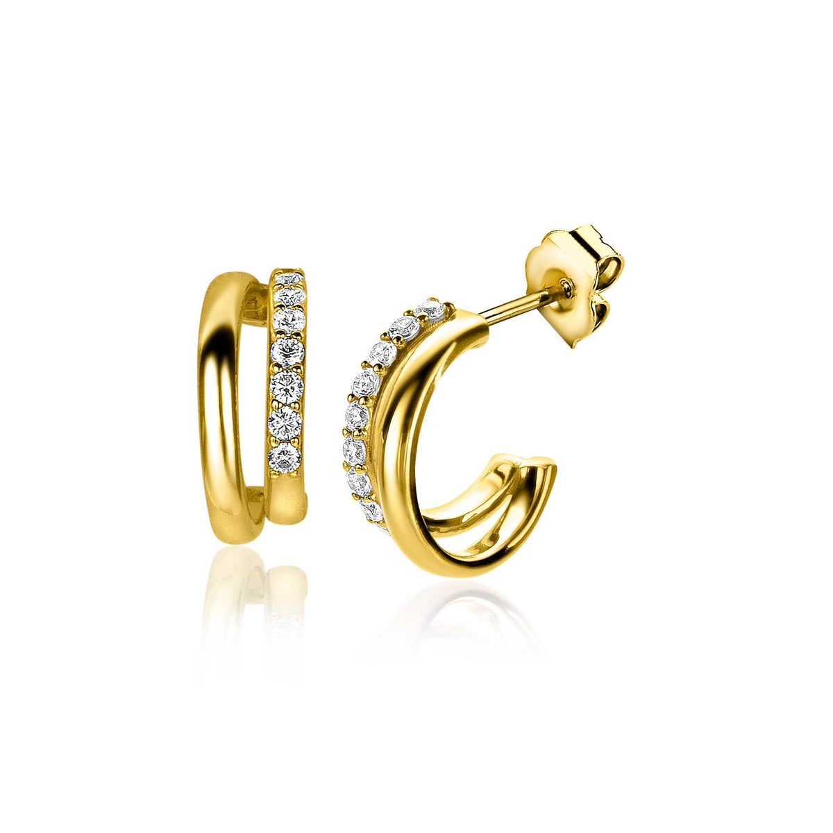 Pendientes de aro dorados con circonitas brillantes en un lado.