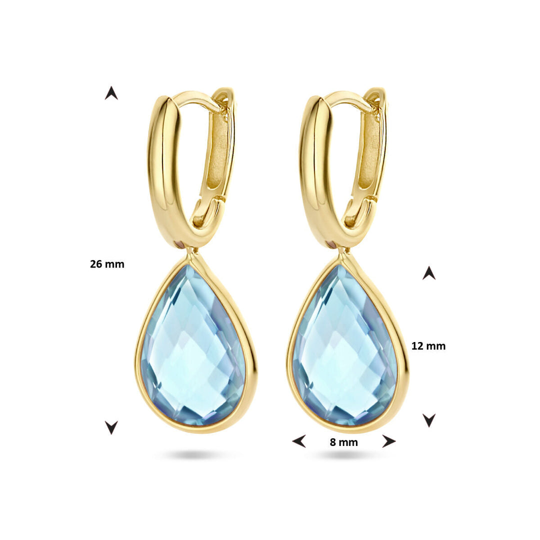 Van der Kooij Collectie klapoorringen blauw topaas 14K geelgoud, elk met een druppelvormige blauwe topaas van 12x8 mm. Totale lengte: 26 mm. Pijlen en maten getoond ter illustratie.
