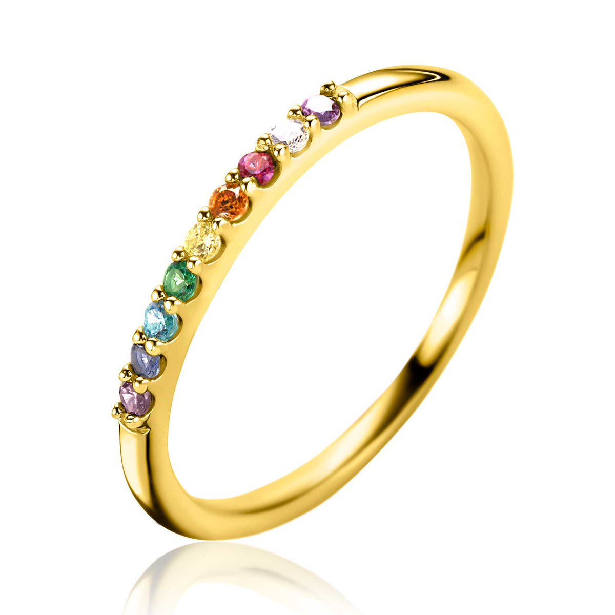 Anillo dorado con piedras de colores en la parte superior.