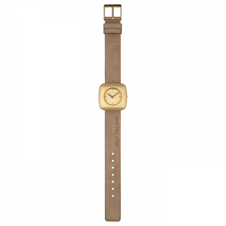 Het Rolf Cremer Horloge 508011 Edge is een quartzhorloge met een beige band en een rechthoekige, goudkleurige wijzerplaat. Het horloge heeft een minimalistisch design met verstelbare gaatjes, een ROLF CREMER-reliëf en een elegante wijzerplaat met minuten- en uurwijzers.