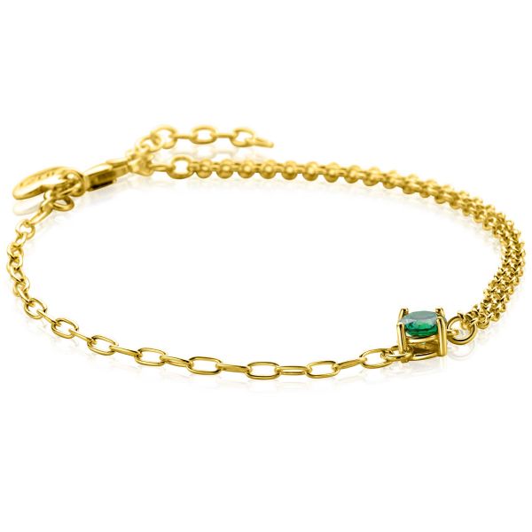 Pulsera de eslabones dorada con un charm de piedra verde en el centro.