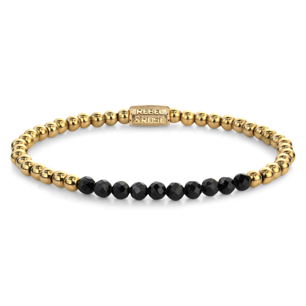 Pulsera de cuentas doradas con piedras negras brillantes en el centro.
