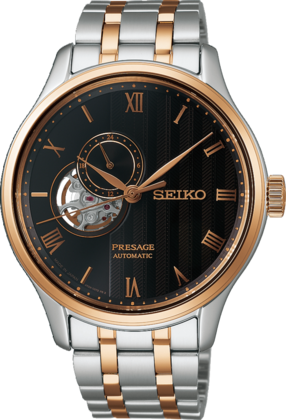 Reloj automático de acero inoxidable con esfera negra, detalles en oro rosa y ventana de movimiento.