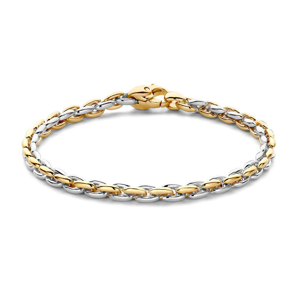 Pulsera bicolor con eslabones entrelazados en oro y plata.