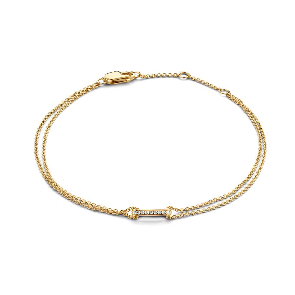 Pulsera de oro amarillo con diamantes brillantes de 0.06 quilates y diseño elegante.