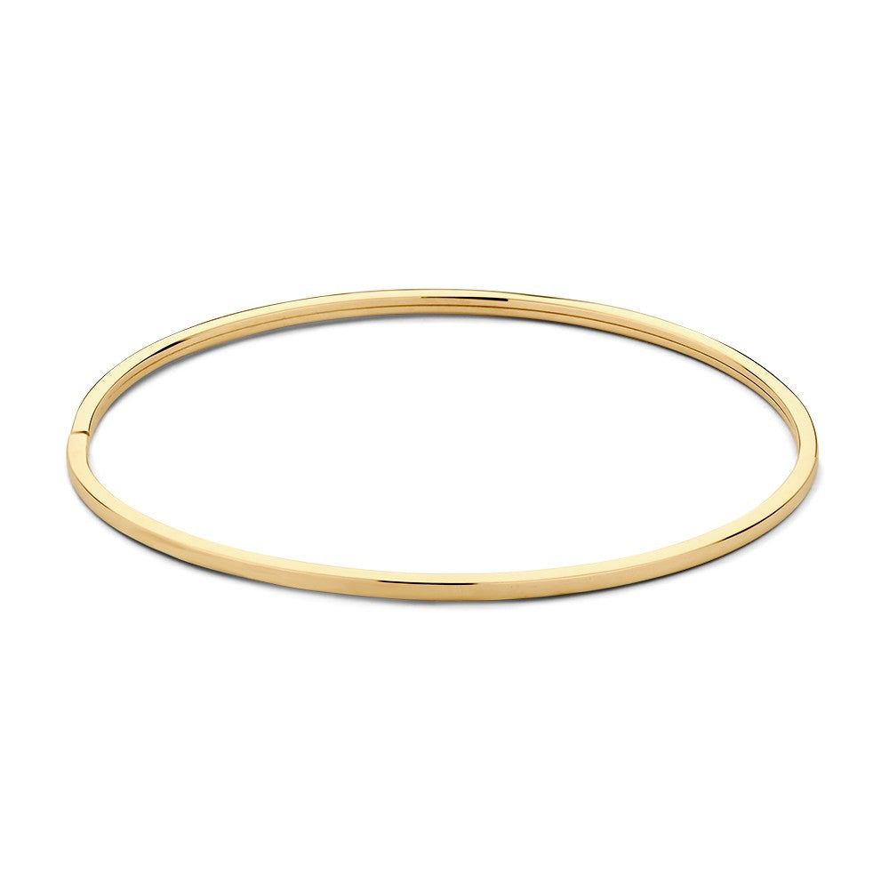 Brazalete bangle de oro amarillo de 14 quilates, diseño simple y elegante.