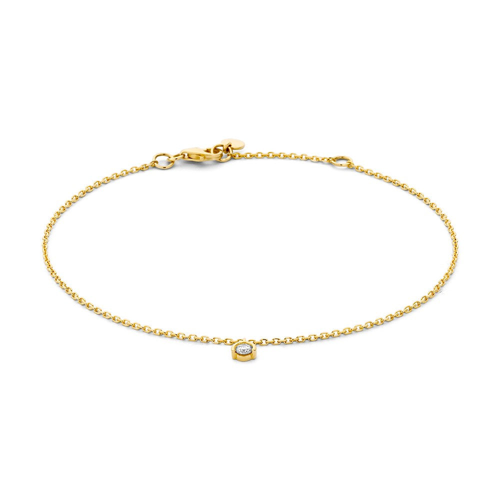 Pulsera de oro amarillo con un brillante de 0,08 crt en el centro.
