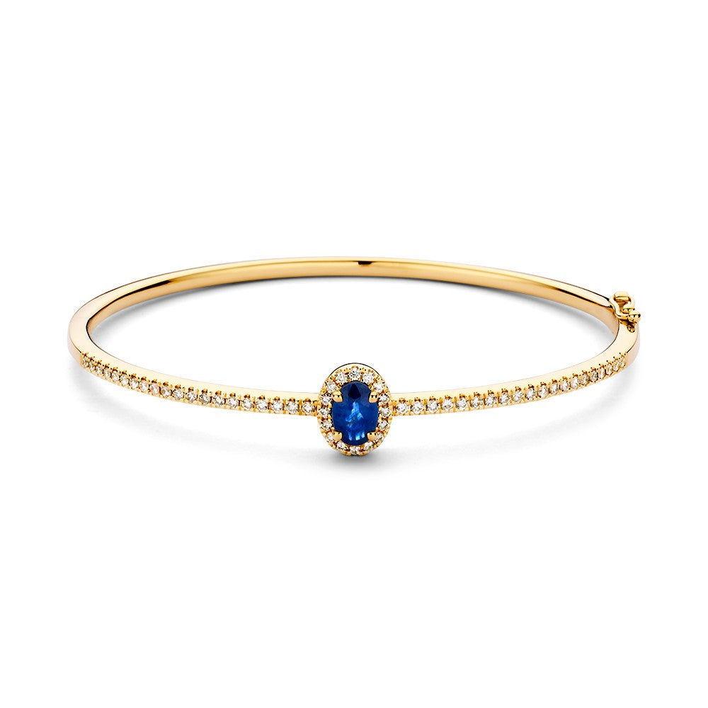 Brazalete dorado con diamantes y zafiro, 14 quilates, con un zafiro ovalado y diamantes alrededor.