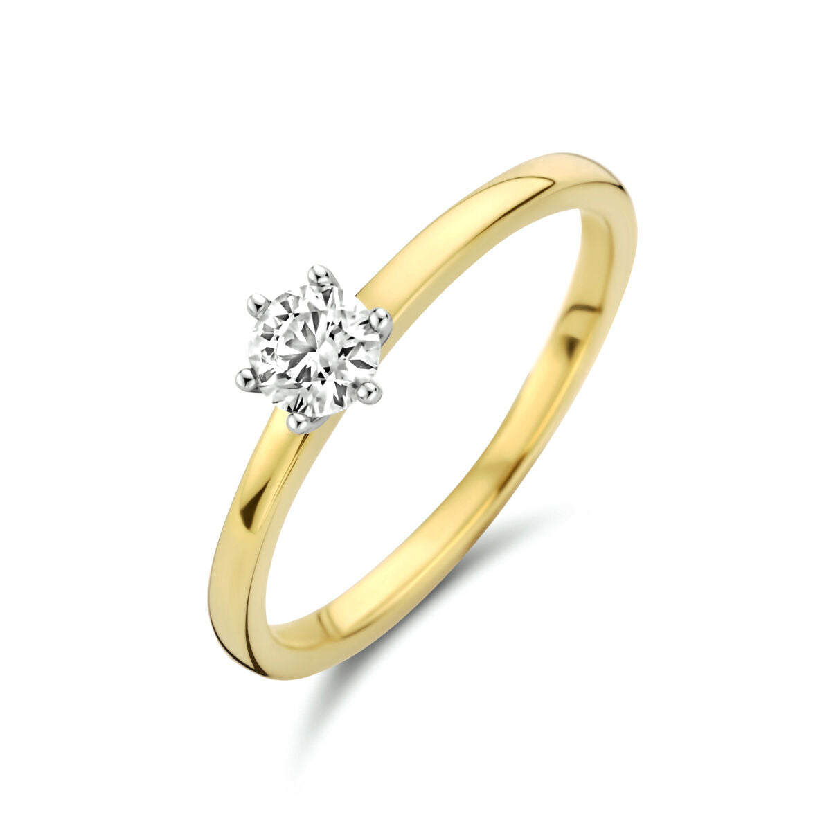 Anillo bicolor de oro amarillo y blanco con diamante de 0.25 ct.