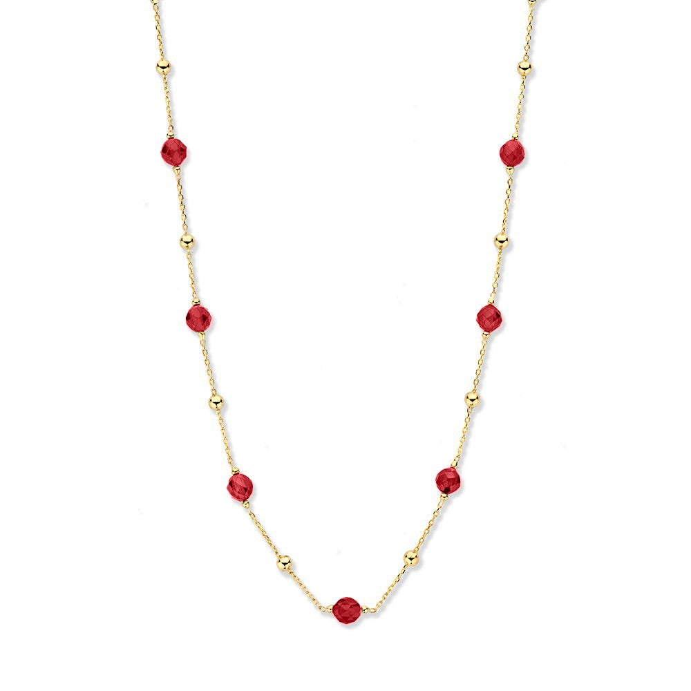 Collar de oro amarillo con zirconitas rojas y esferas doradas.