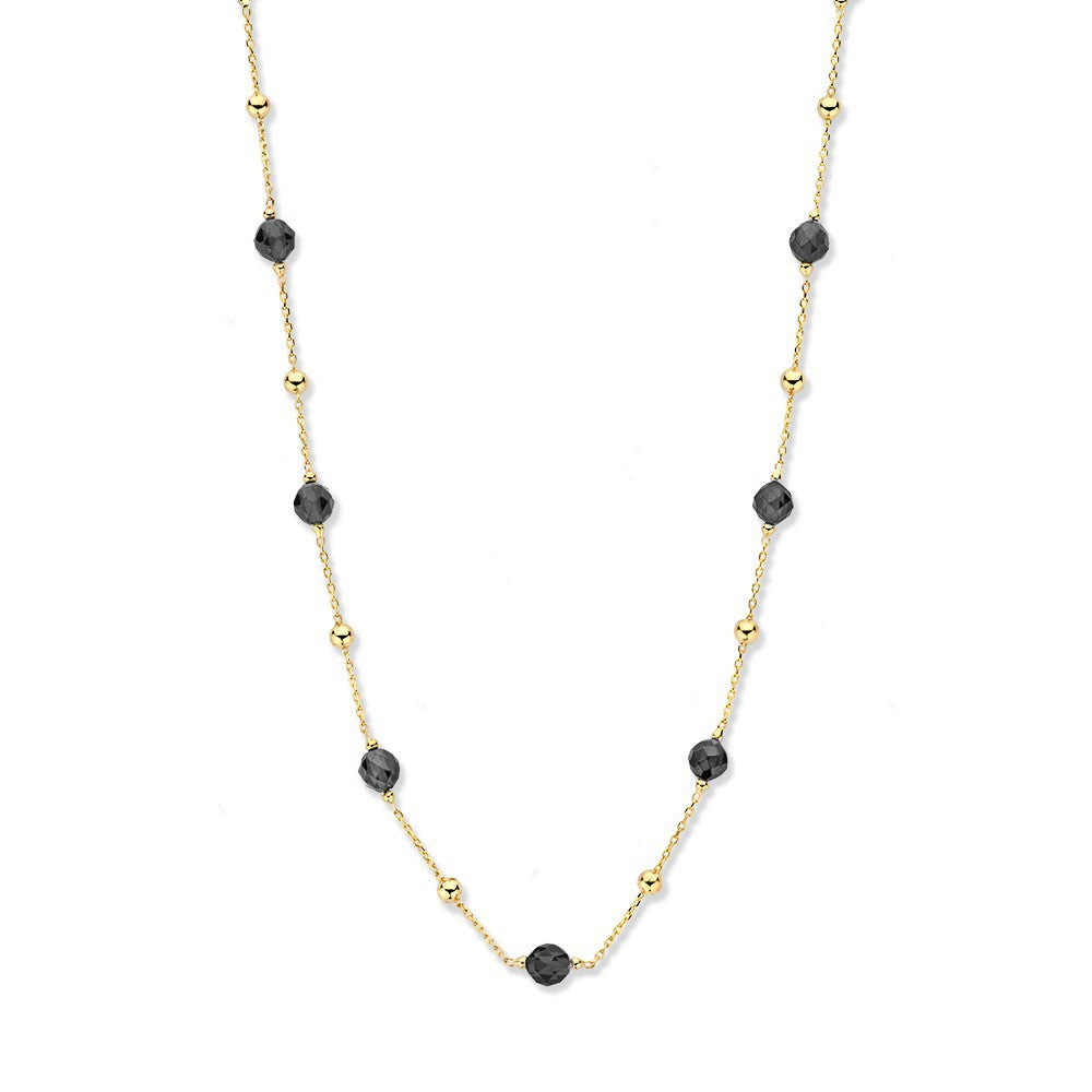 Collar de oro amarillo con circonitas negras y eslabones intercalados.