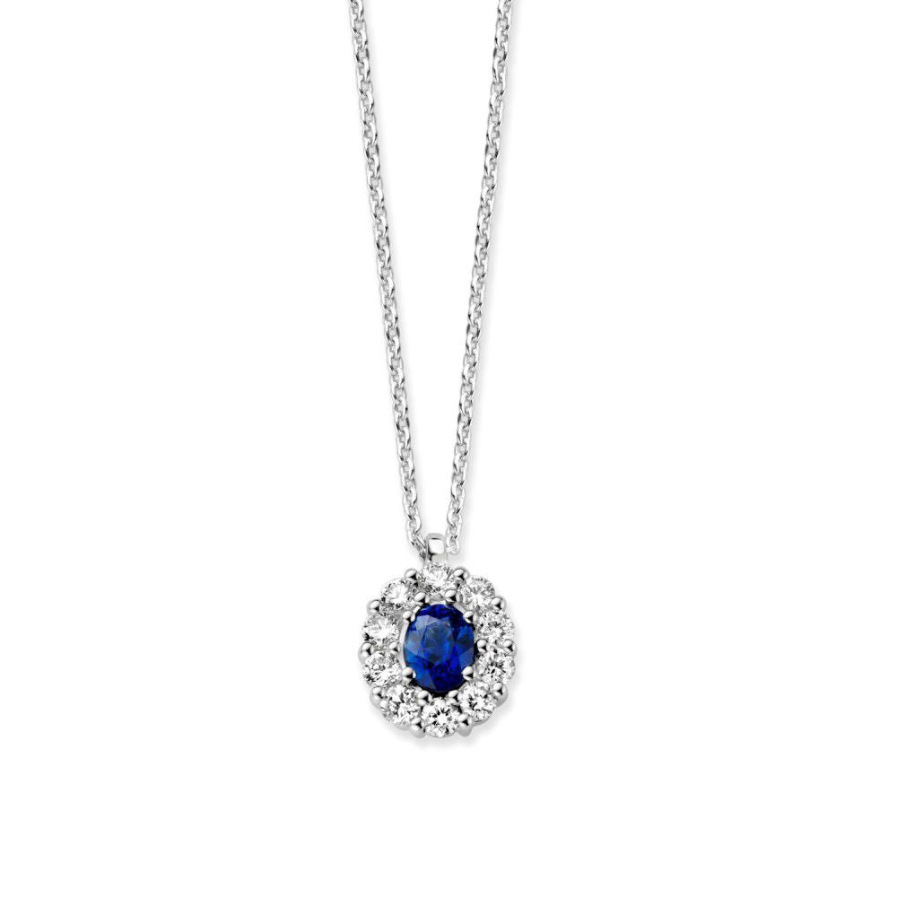 Collar de oro blanco de 14 quilates con colgante de zafiro rodeado de diamantes.