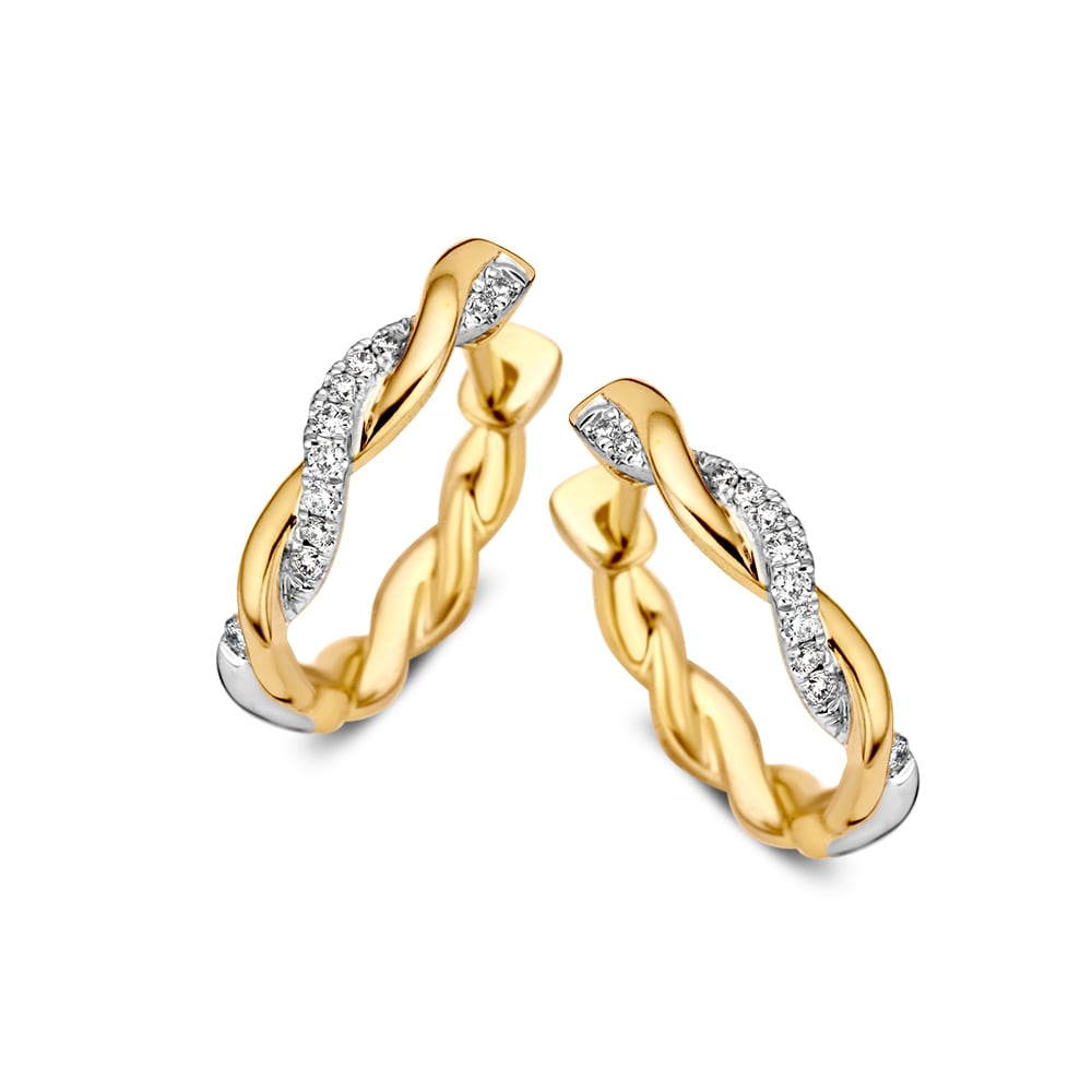 Pendientes bicolores de oro amarillo y blanco con diamantes brillantes de 0.11 quilates.