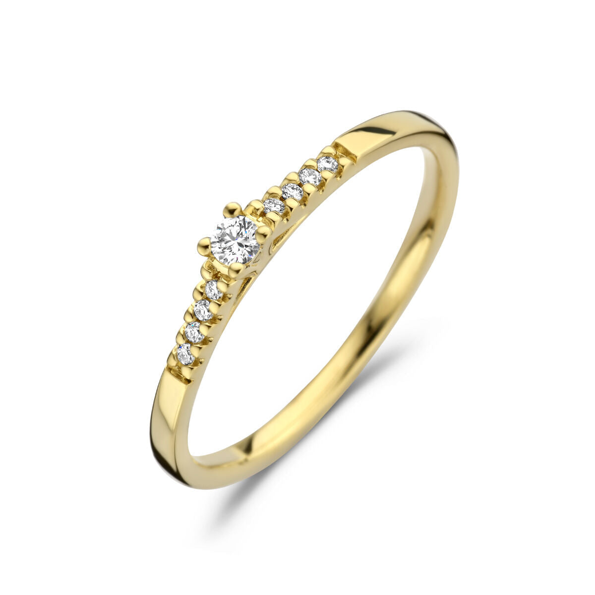 Anillo de oro amarillo de 14K con diamante central de 0.07 ct y brillantes en el aro.
