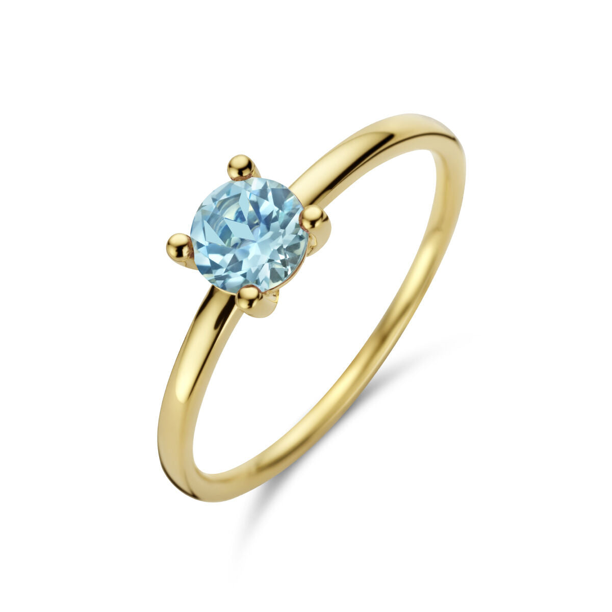 Anillo de oro amarillo de 14K con topacio azul en forma redonda.