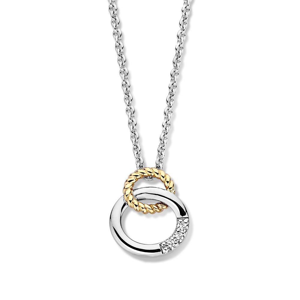 Cadena plateada con colgante dorado y tres circonitas.