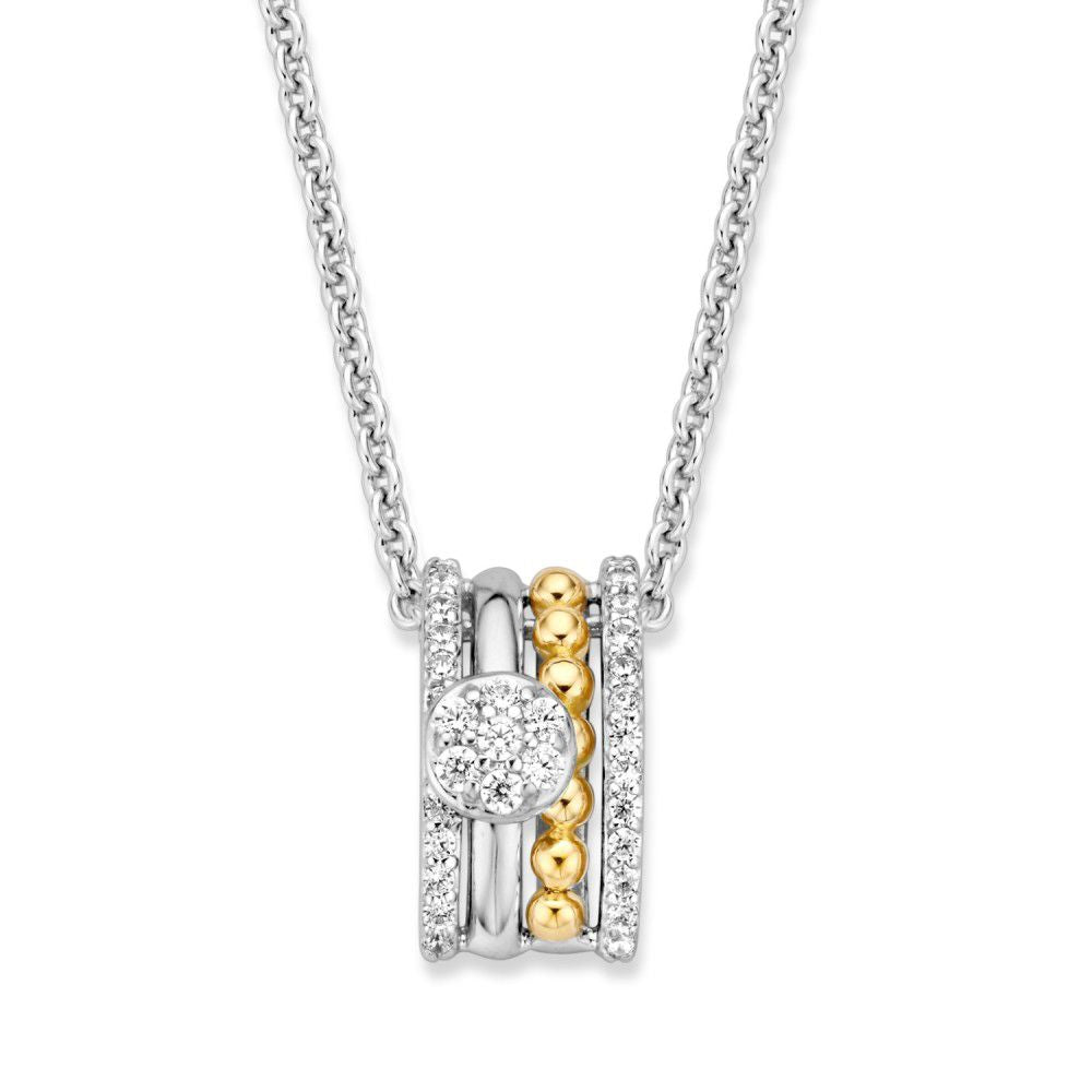 Colgante plateado y dorado con circonitas blancas, forma rectangular y detalles brillantes.