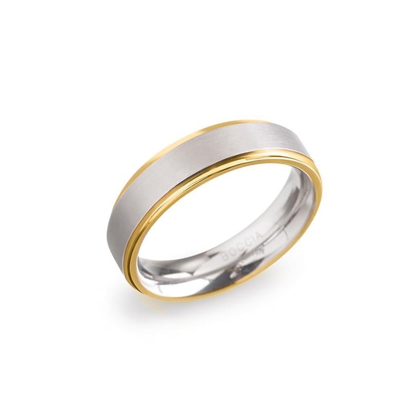 Anillo bicolor de titanio con acabado mate y detalles en dorado.