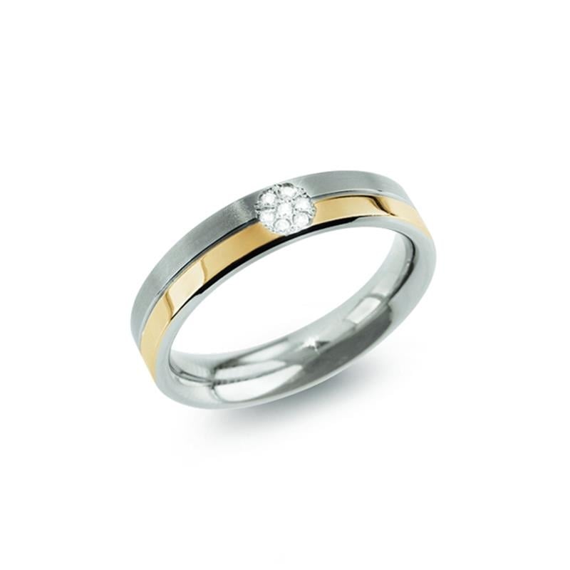 Anillo bicolor de titanio con diamante, acabado brillante y diseño moderno.