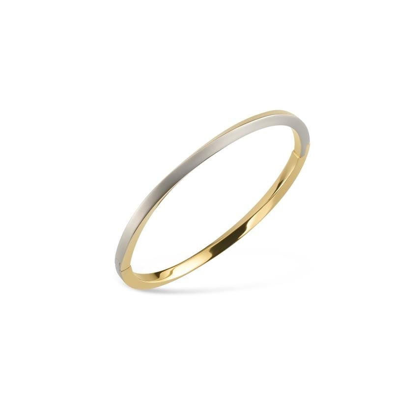 Pulsera de titanio bicolor con un acabado brillante, combinando tonos dorado y plateado.