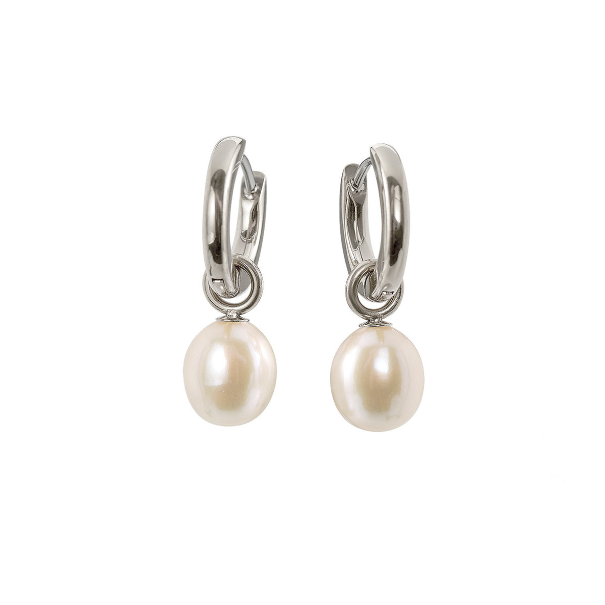 Pendientes largos de titanio con perlas blancas.