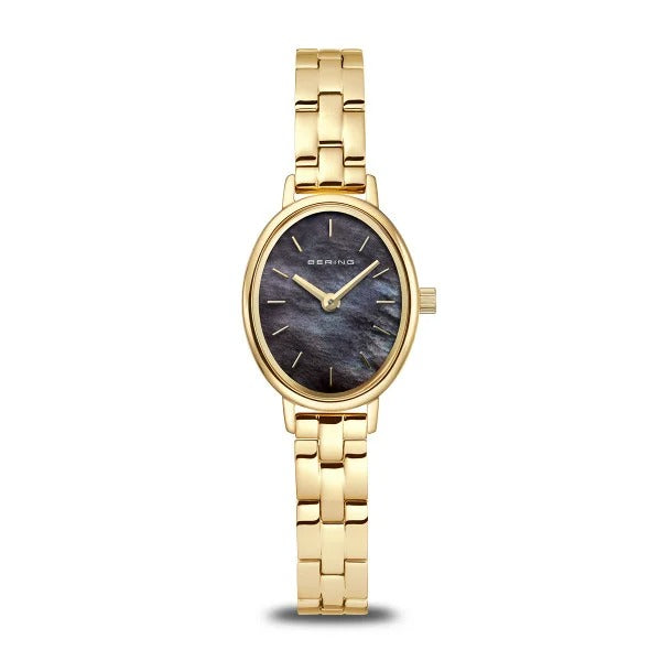 Reloj ovalado dorado con esfera negra y pulsera de eslabones.