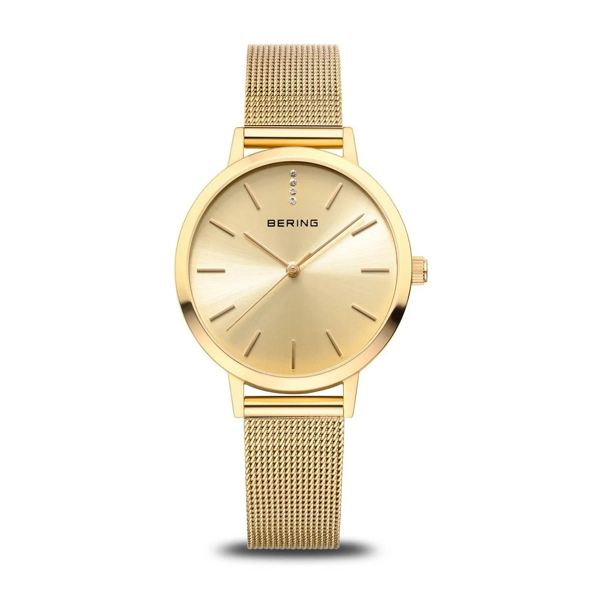 Reloj de mujer con esfera dorada, correa de malla dorada y detalles minimalistas.