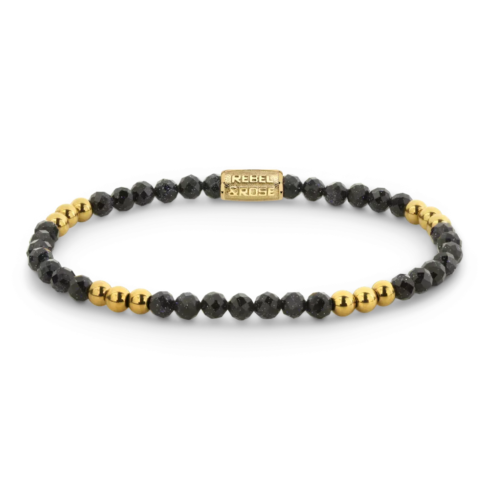 Pulsera de piedras negras con detalles en oro amarillo.