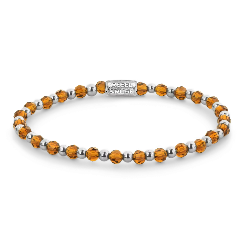 Pulsera de cristales ámbar y metal plateado con detalles brillantes.