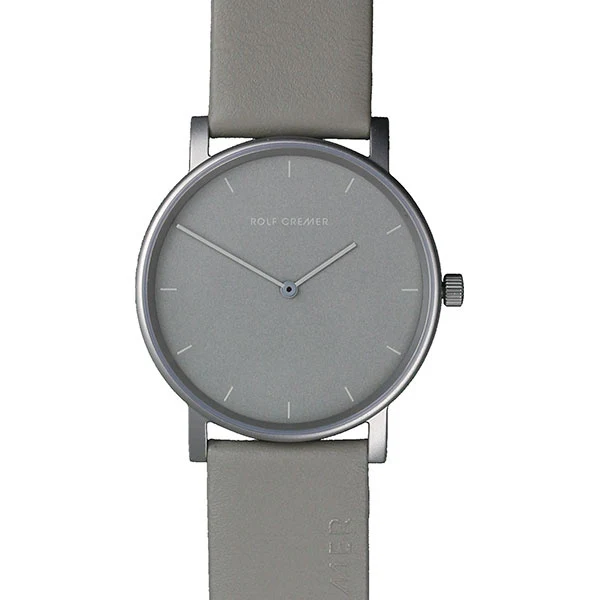 Reloj de esfera gris con correa de cuero gris y caja metálica plateada.