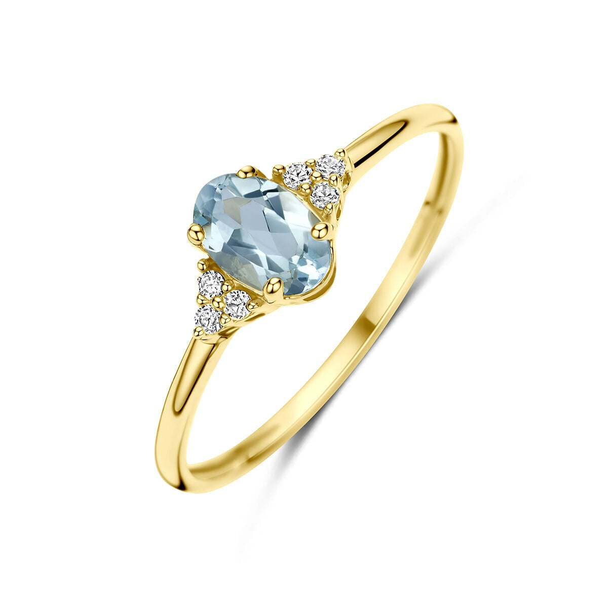 Anillo de oro amarillo de 14k con topacio azul y circonitas.