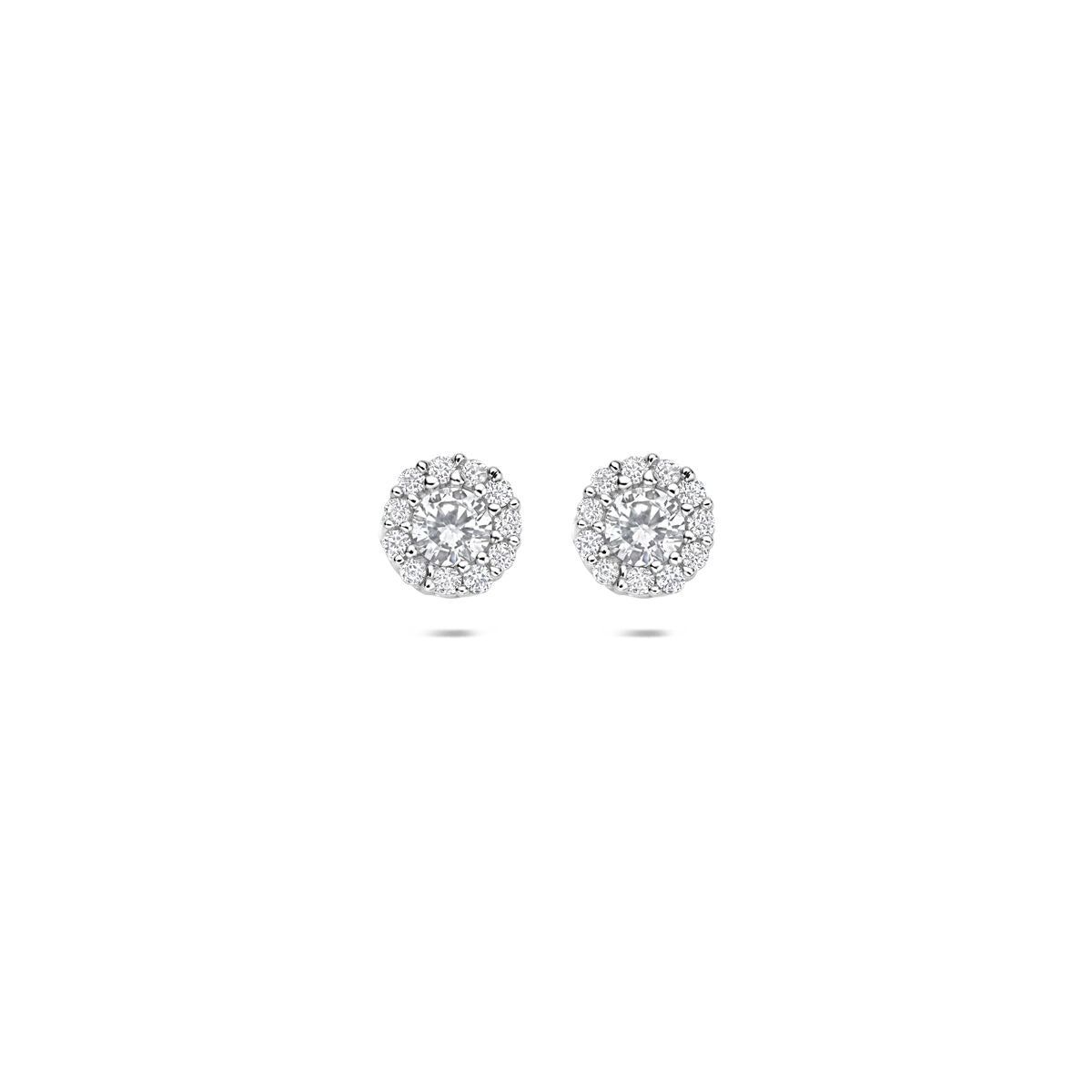 Pendientes de primera puesta de plata rodiada con circonitas en forma de flor.