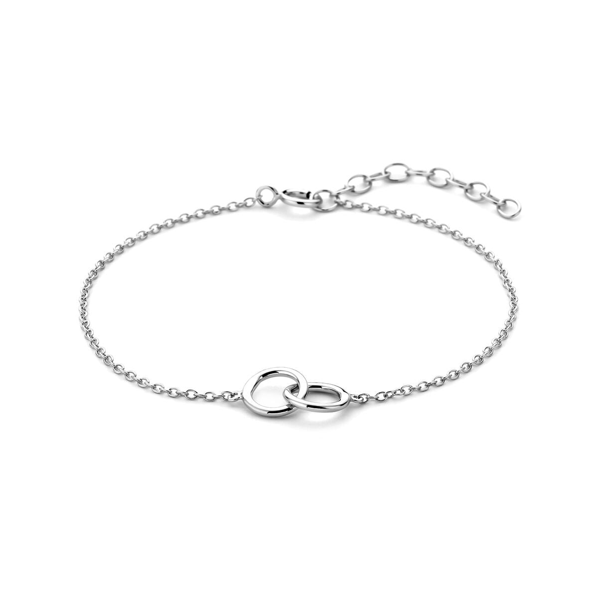 Pulsera de dama plateada con círculos, acabada en rodio, de diseño delicado y cadena fina.
