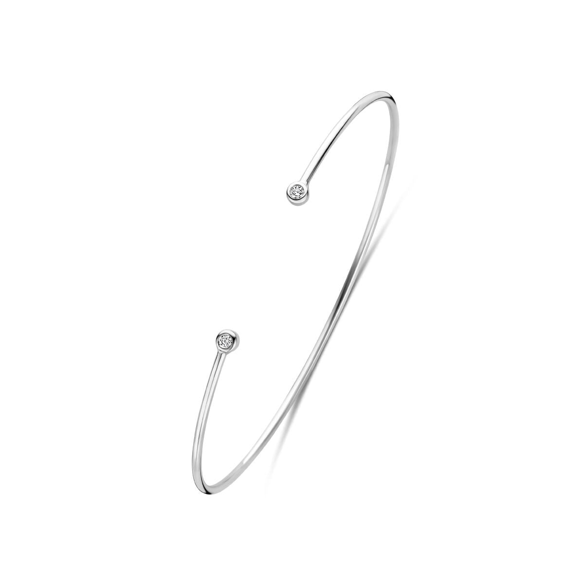 Pulsera de plata 925 rodiada con dos zirconias brillantes en los extremos.