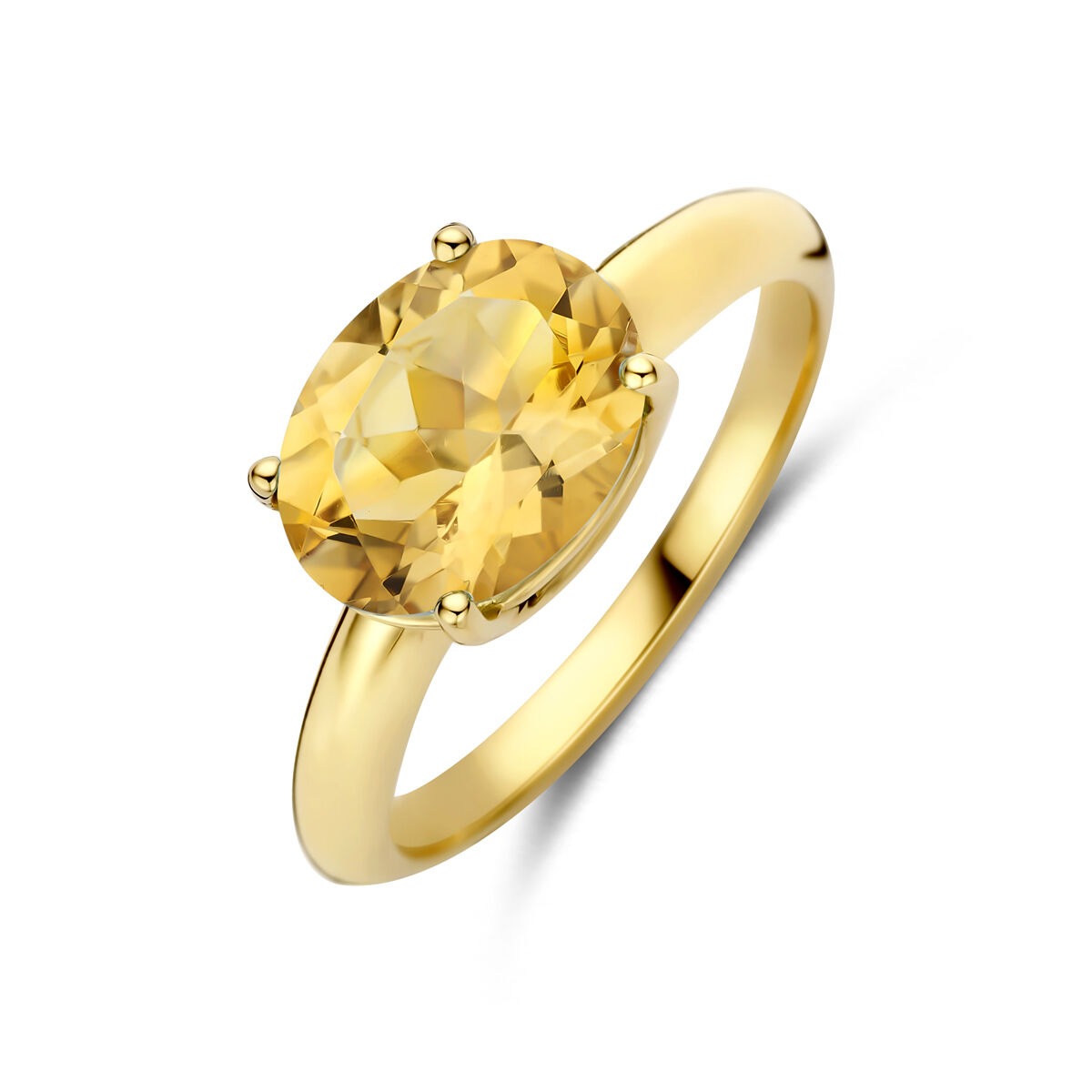 Anillo de oro amarillo de 14k con citrino ovalado en engaste de cuatro garras.