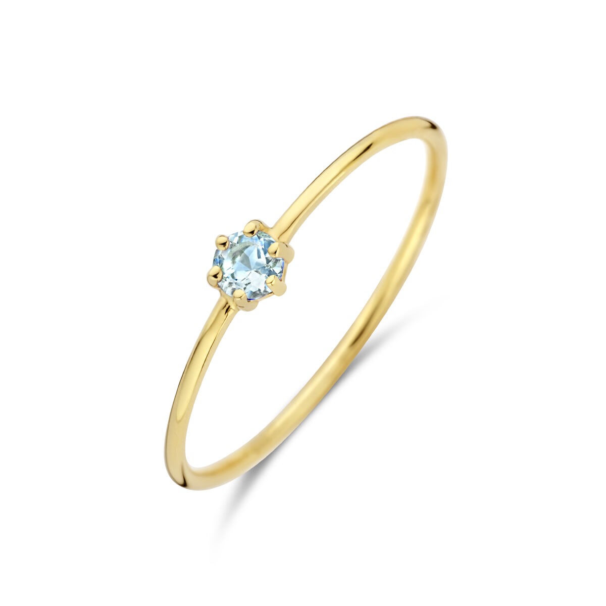 Anillo de oro amarillo de 14k con una aquamarina brillante en el centro.