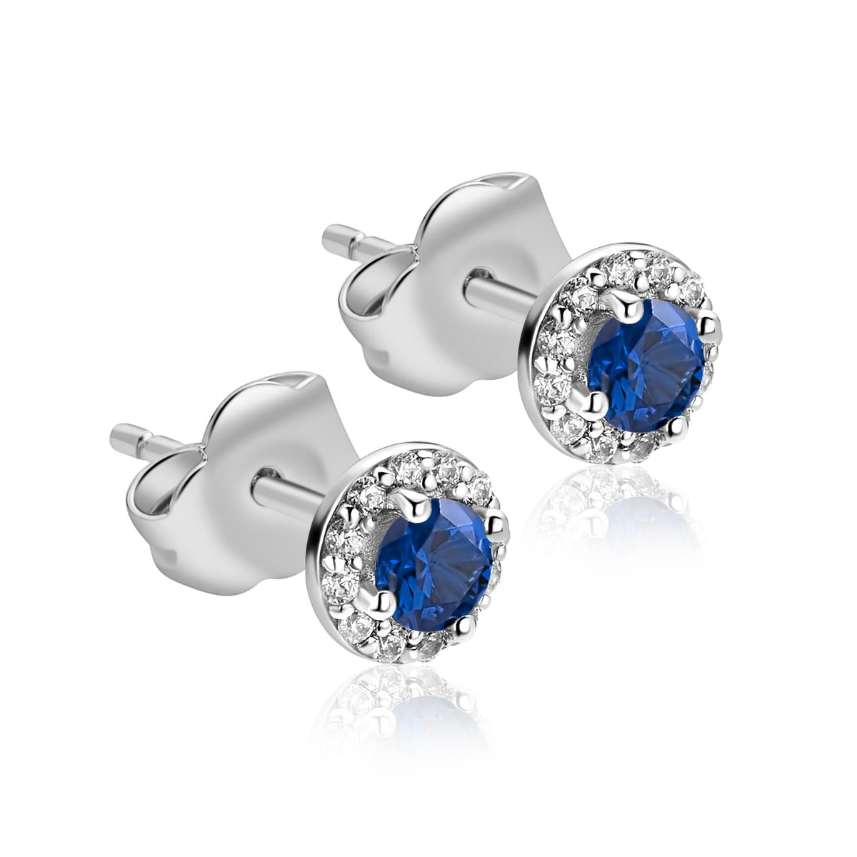 Pendientes de plata con piedra azul y circonitas alrededor.